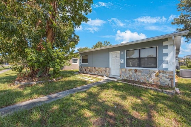 ranch-style home with a front yard