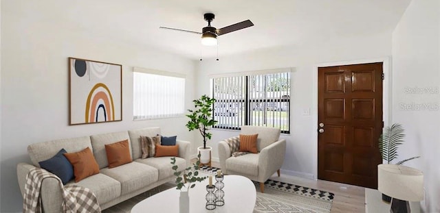 living room with light hardwood / wood-style flooring and ceiling fan