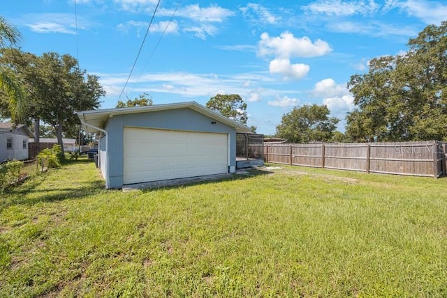 garage with a yard