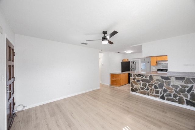 living room with ceiling fan and light wood-type flooring