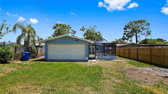 garage with a lawn