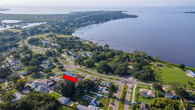 birds eye view of property featuring a water view and a residential view