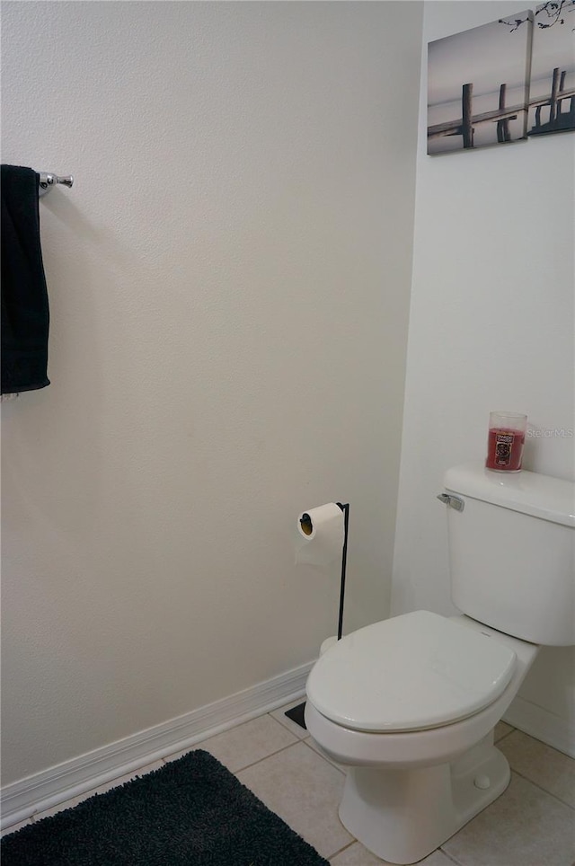 bathroom featuring tile patterned flooring and toilet