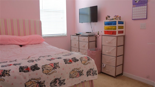 bedroom with light colored carpet