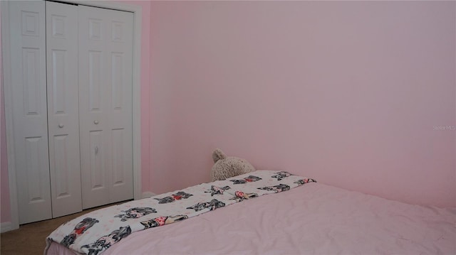 unfurnished bedroom featuring a closet and carpet floors