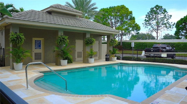 view of pool featuring a patio