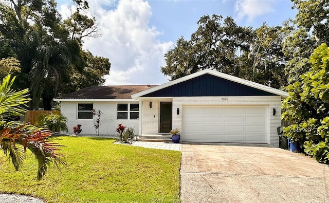 ranch-style home featuring driveway, fence, brick siding, a front lawn, and a garage