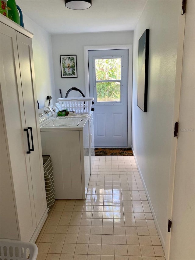 laundry room with light tile patterned flooring, laundry area, and independent washer and dryer