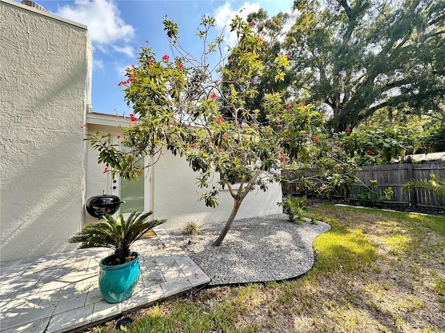 view of yard featuring a patio area and fence