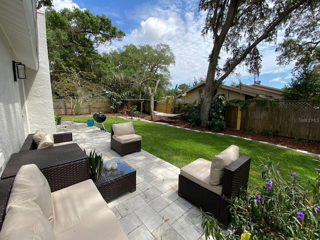 view of patio with an outdoor hangout area and a fenced backyard