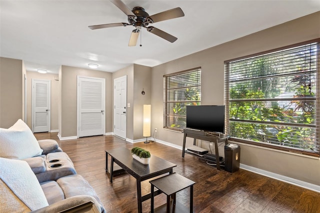 living room featuring ceiling fan and hardwood / wood-style floors