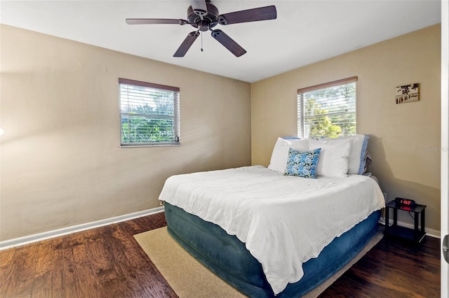 bedroom featuring ceiling fan and dark hardwood / wood-style flooring