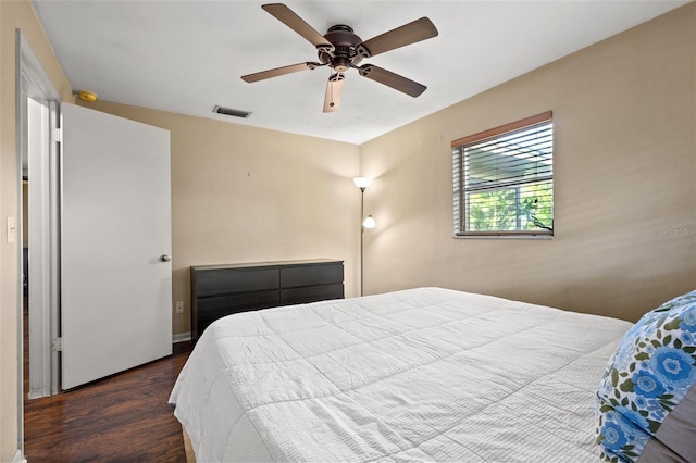 bedroom with ceiling fan and hardwood / wood-style floors