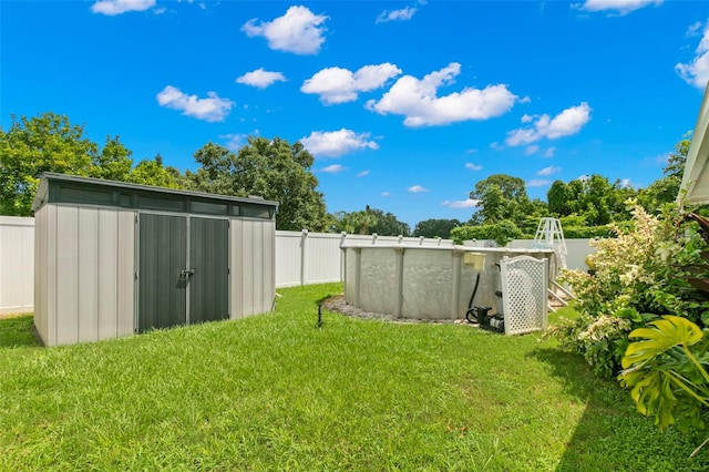 view of yard with a storage unit