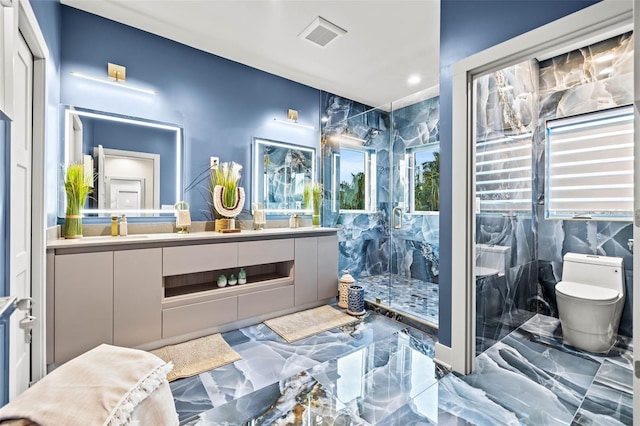 full bathroom with marble finish floor, a marble finish shower, double vanity, visible vents, and toilet