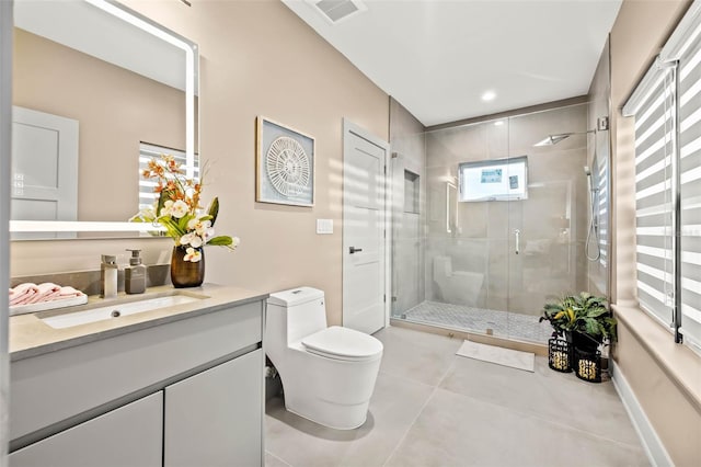 bathroom featuring a stall shower, baseboards, visible vents, toilet, and vanity