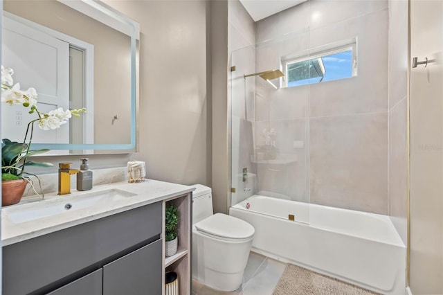 bathroom with shower / bathtub combination, vanity, and toilet