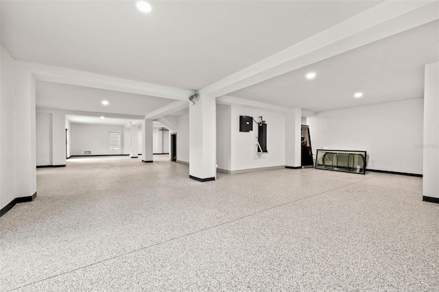 interior space featuring baseboards and recessed lighting