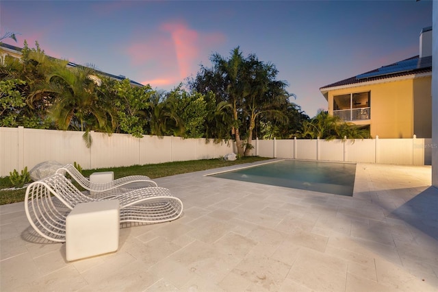 view of patio terrace at dusk