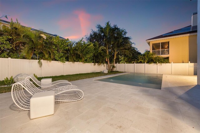 view of pool featuring a patio area and a fenced backyard