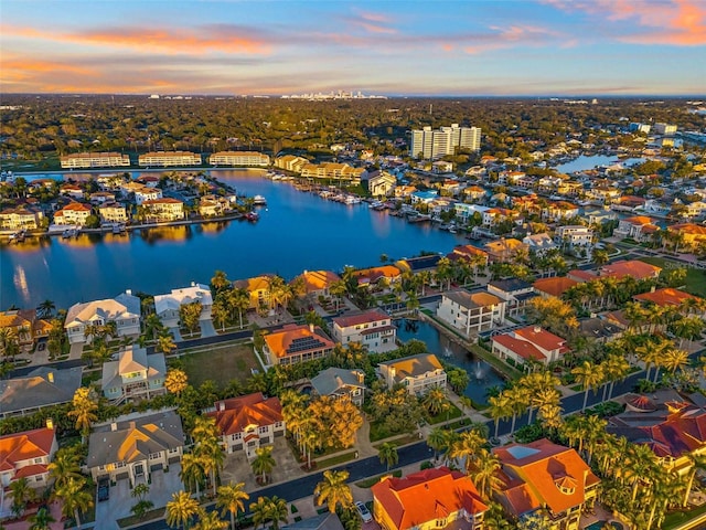 aerial view at dusk with a water view