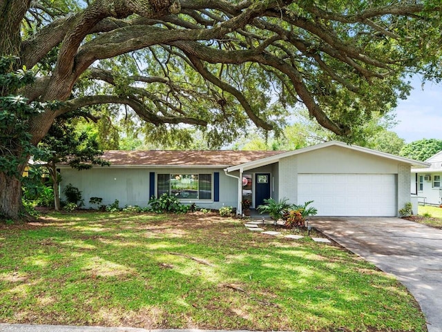 single story home featuring a garage and a front lawn