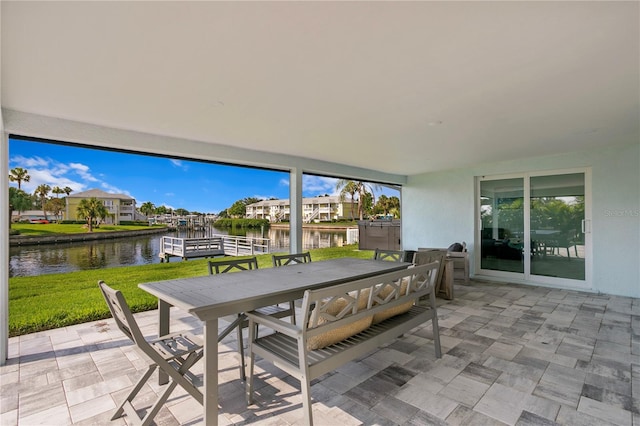 view of patio with a water view