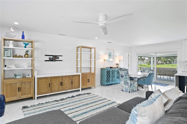 living room with ceiling fan and light tile patterned floors