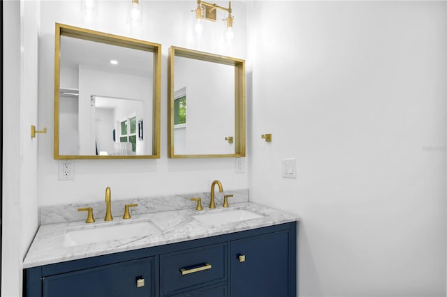 bathroom featuring dual vanity