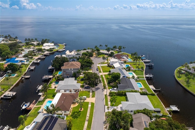 birds eye view of property with a water view