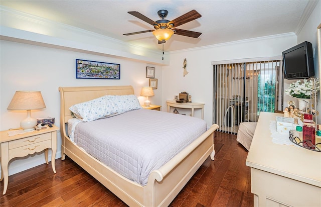 bedroom featuring ceiling fan, dark wood-type flooring, and ornamental molding