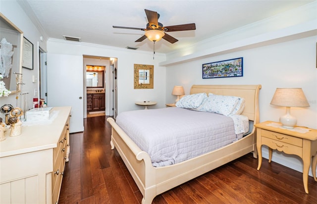 bedroom with ceiling fan, ensuite bathroom, crown molding, and dark wood-type flooring