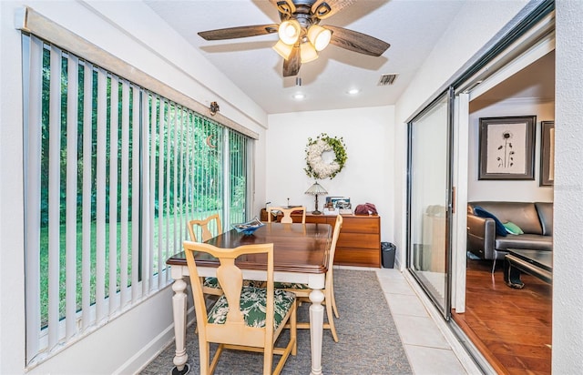 dining room featuring a wealth of natural light, ceiling fan, and light tile patterned floors