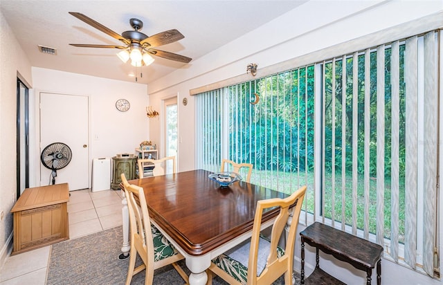 dining space featuring ceiling fan and light tile patterned flooring