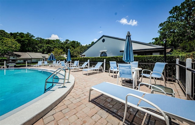 view of swimming pool featuring a patio