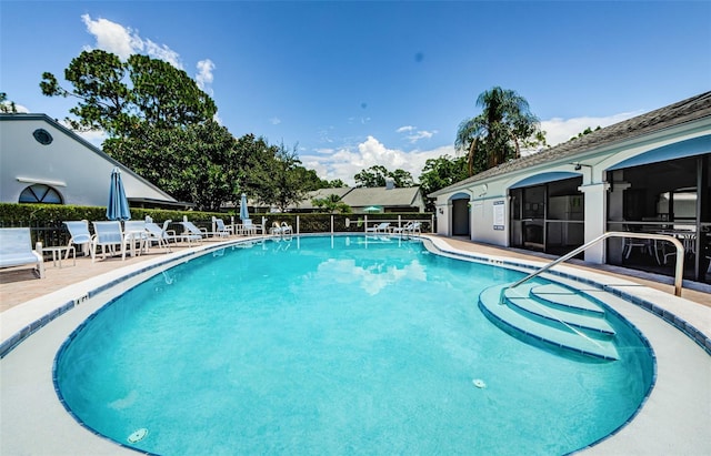 view of swimming pool featuring a patio