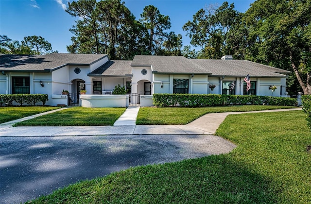 single story home with a front yard