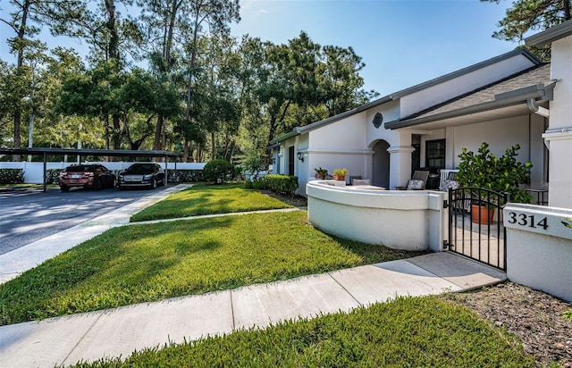 view of yard featuring a carport