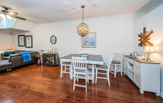 dining room with ceiling fan, dark wood-type flooring, and crown molding