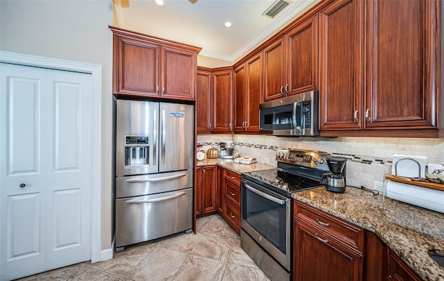 kitchen with stone counters, light tile patterned floors, decorative backsplash, and stainless steel appliances