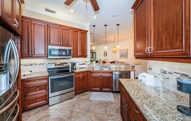 kitchen featuring stainless steel appliances, decorative light fixtures, sink, kitchen peninsula, and ceiling fan