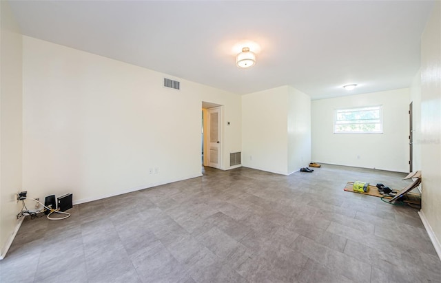 empty room with light tile patterned floors