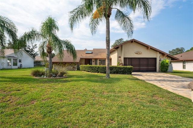 view of front of house with a garage and a front yard