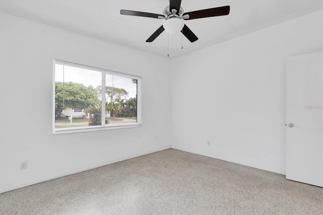 unfurnished room with ceiling fan