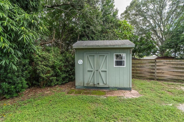 view of outbuilding with a lawn