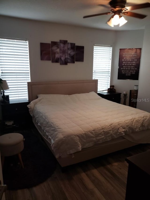 bedroom with ceiling fan and hardwood / wood-style floors