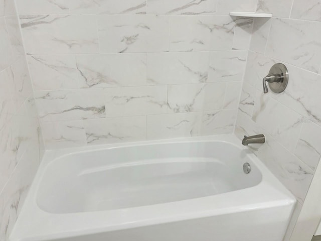 full bath with a bath and walk in shower