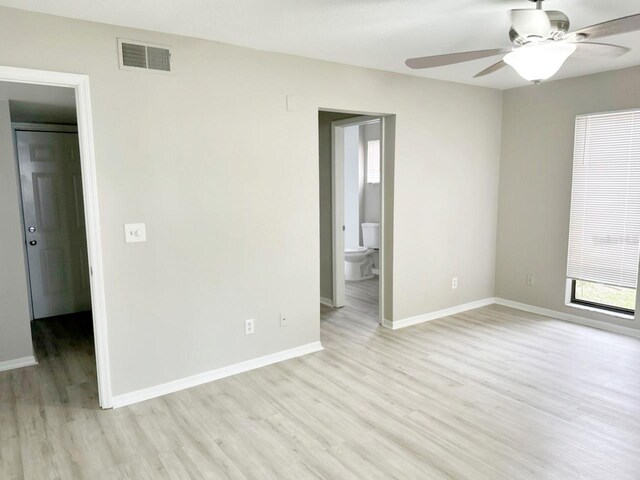 spare room with light hardwood / wood-style flooring and ceiling fan