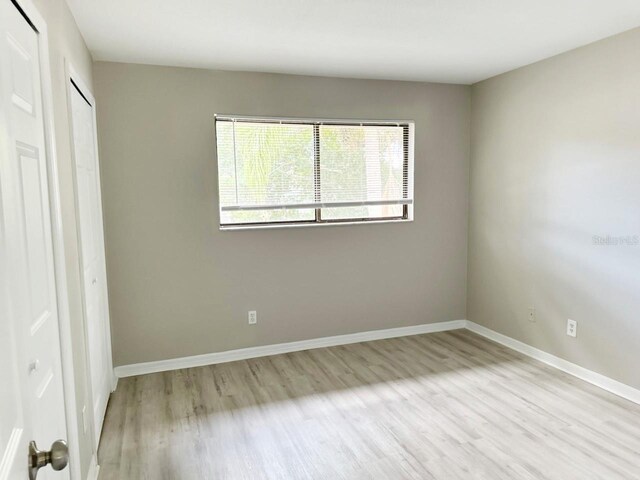 unfurnished bedroom featuring light wood-type flooring