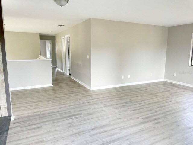 empty room with light wood-type flooring